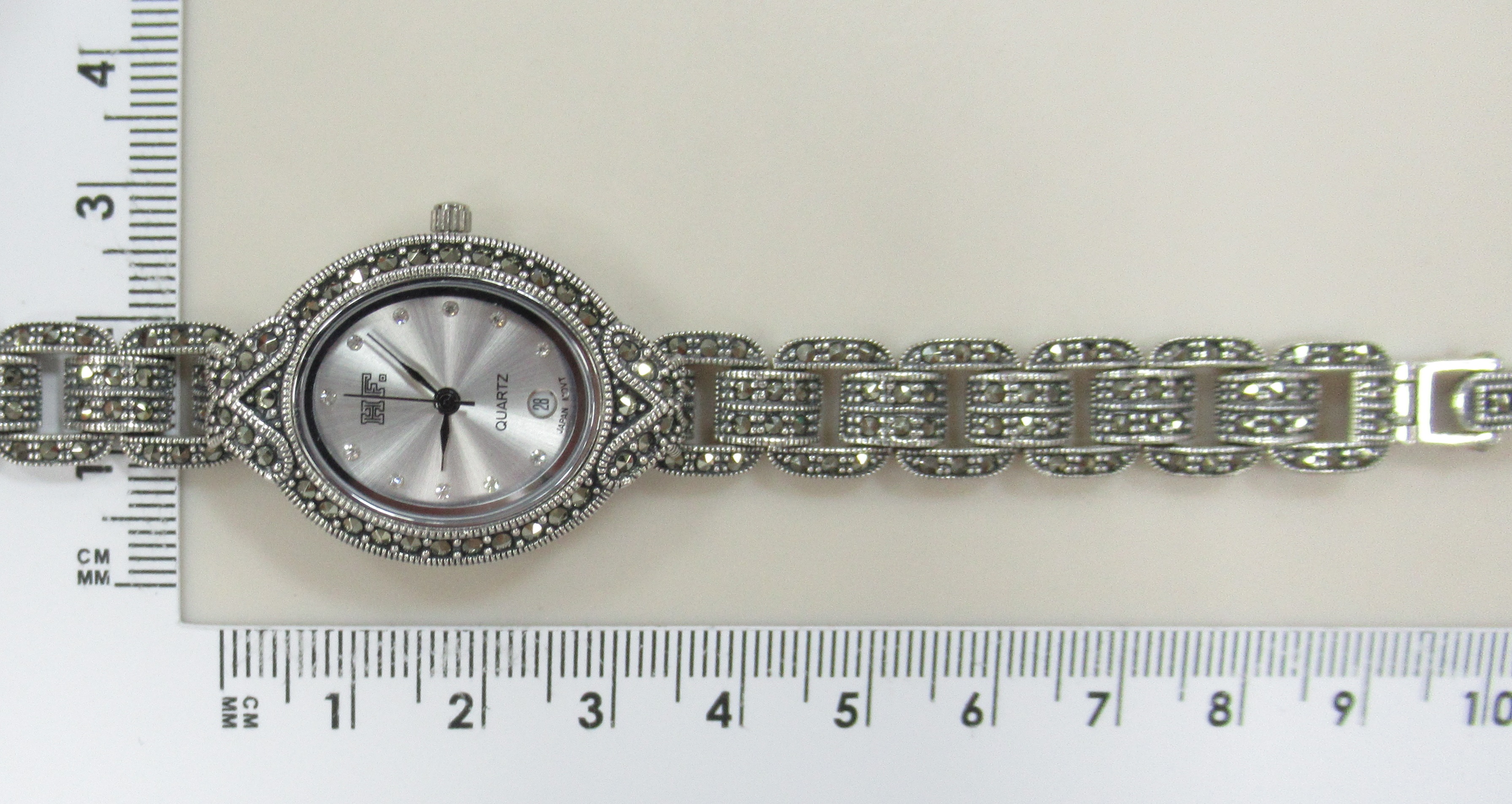 Серебряные часы с марказитами